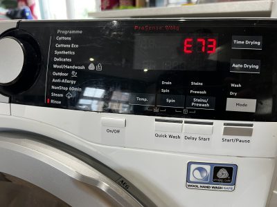 AEG washer dryer showing E73 error, washing but not drying